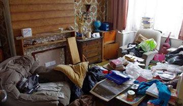 A living room filled with rubbish